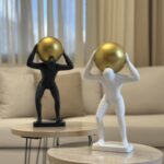 Resin Man with Golden Sphere